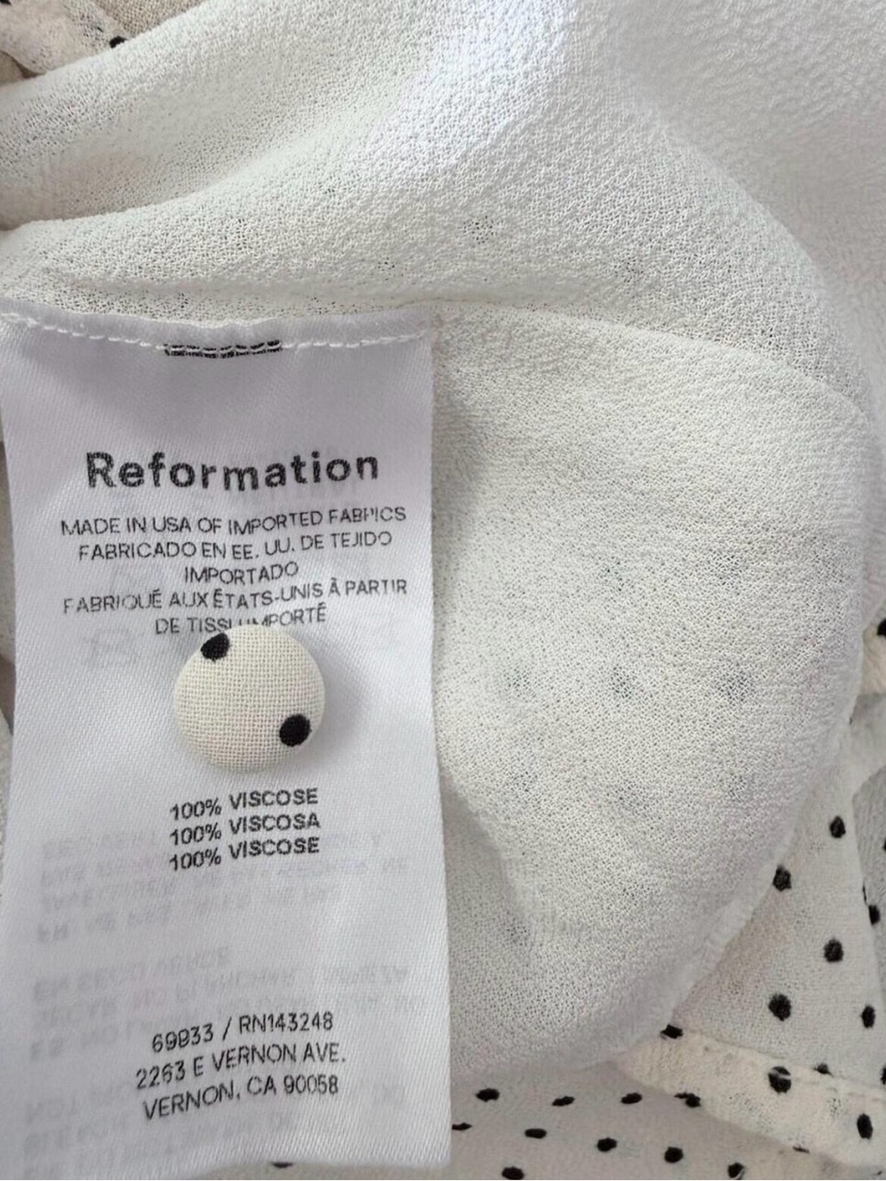 Reformation Kaylia Polka Dot Mini Dress in cream with a black bow - Picture 4 of 9